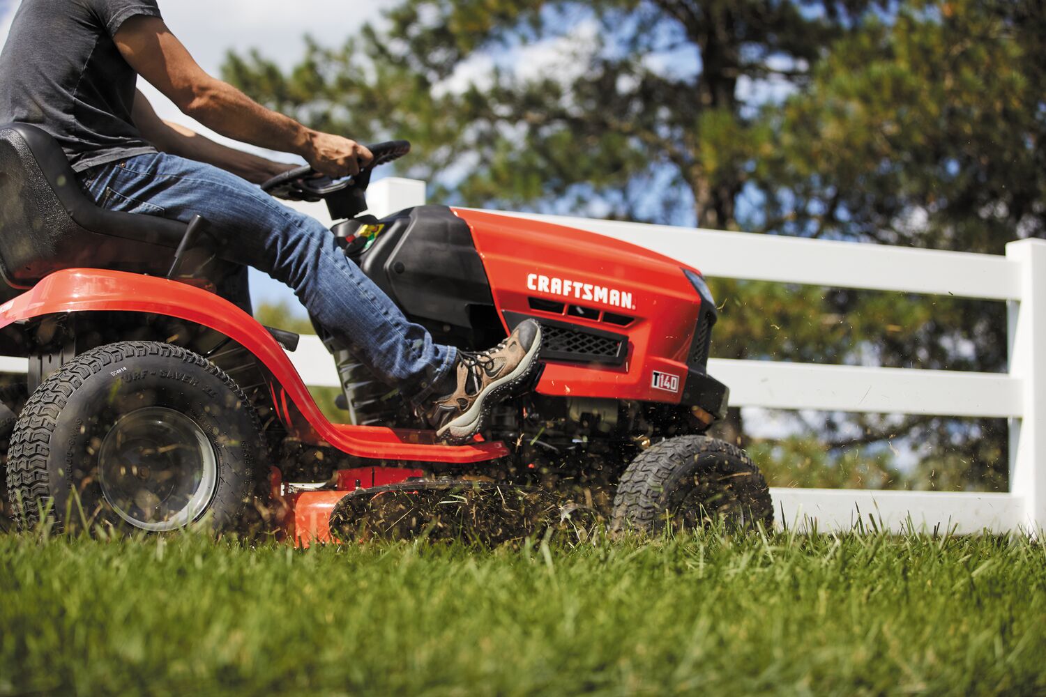 Automatic riding mower mowing grass.