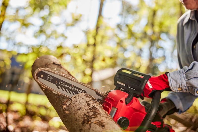 Side view of female cutting with V20 Chainsaw