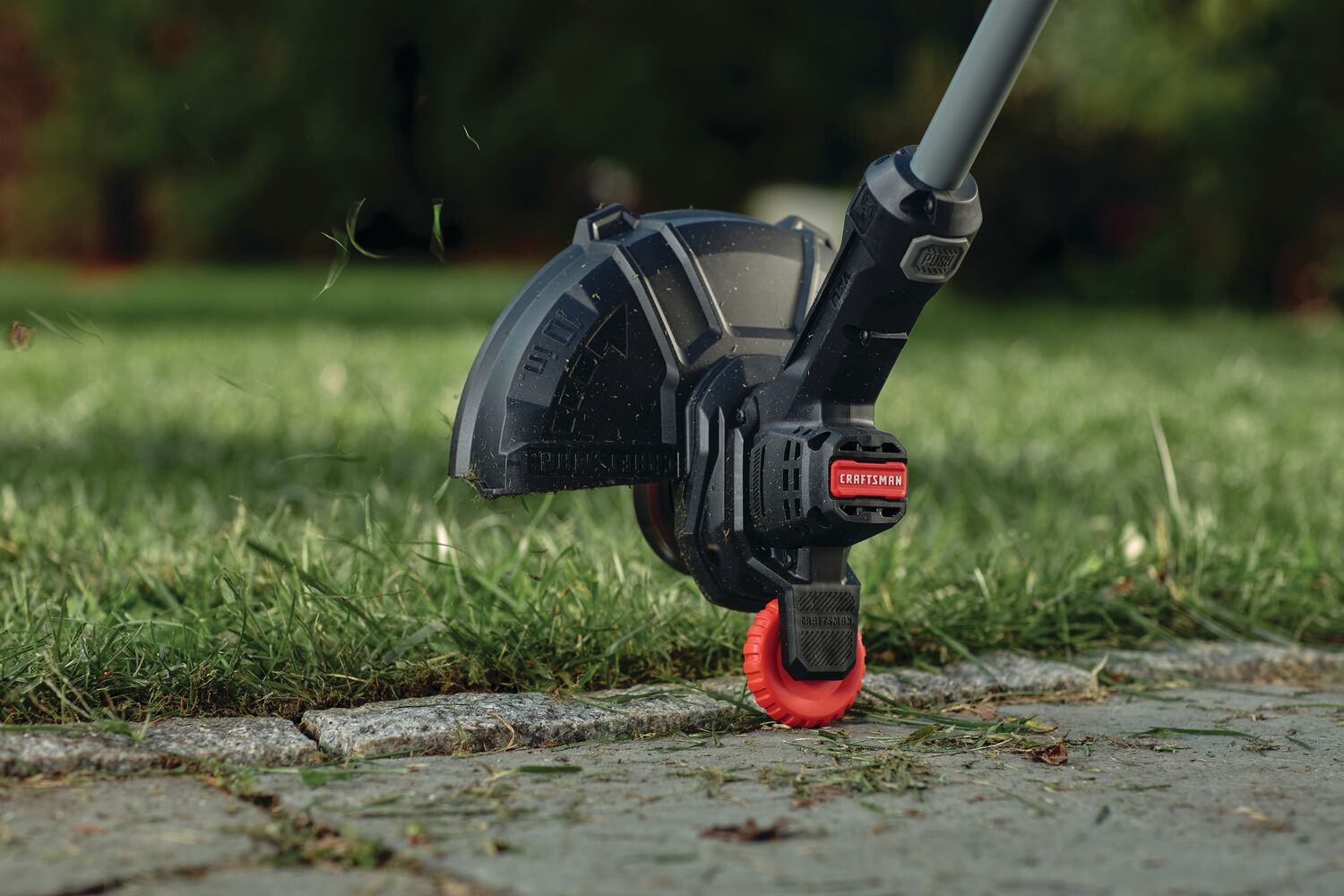 Integrated wheel edged guide feature of 20 volt cordless 10 inch weedwacker string trimmer and edger.