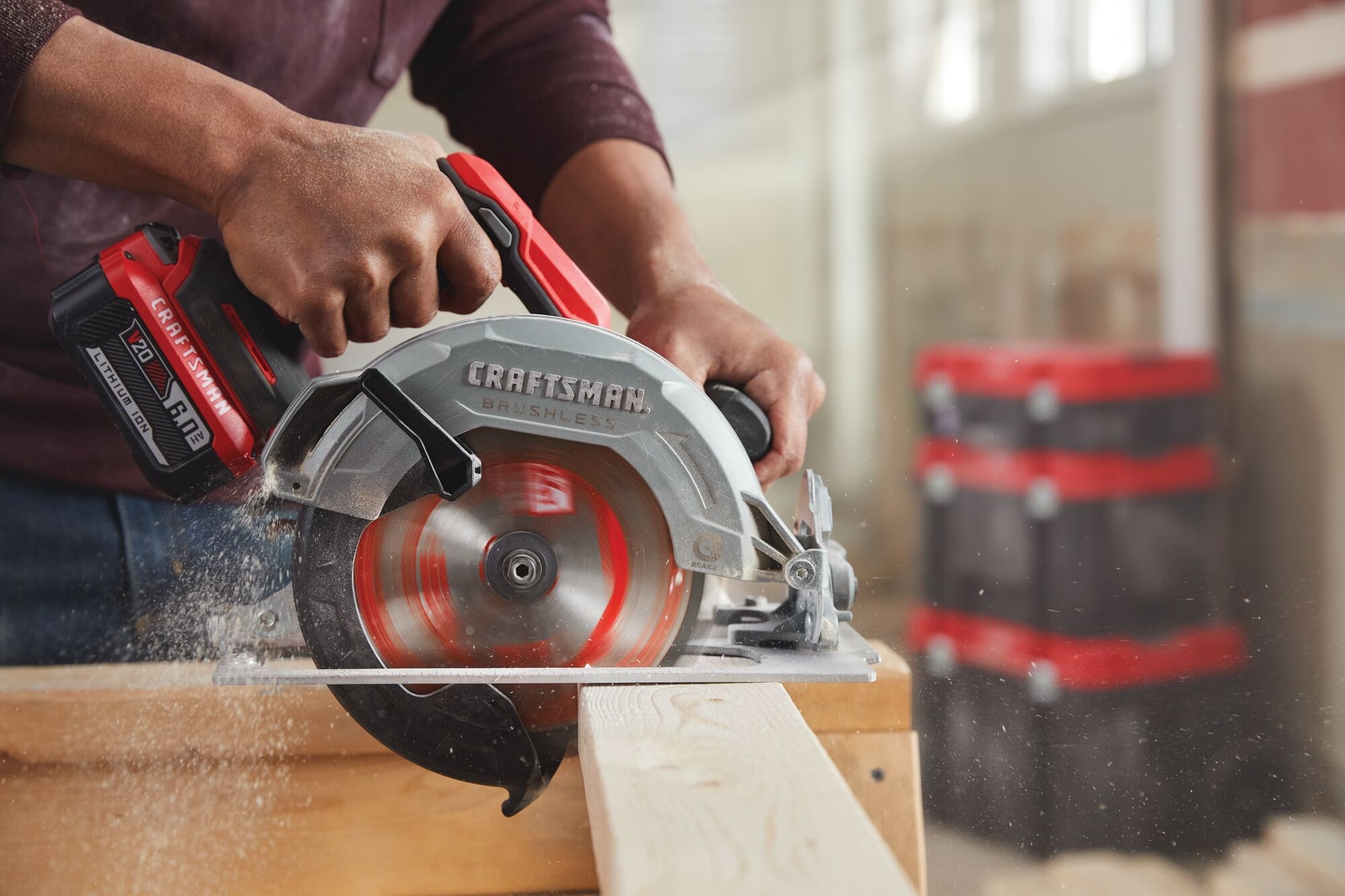 20 volt 7 1 quarter inch brushless cordless circular saw being used by a person to cut wooden plank.