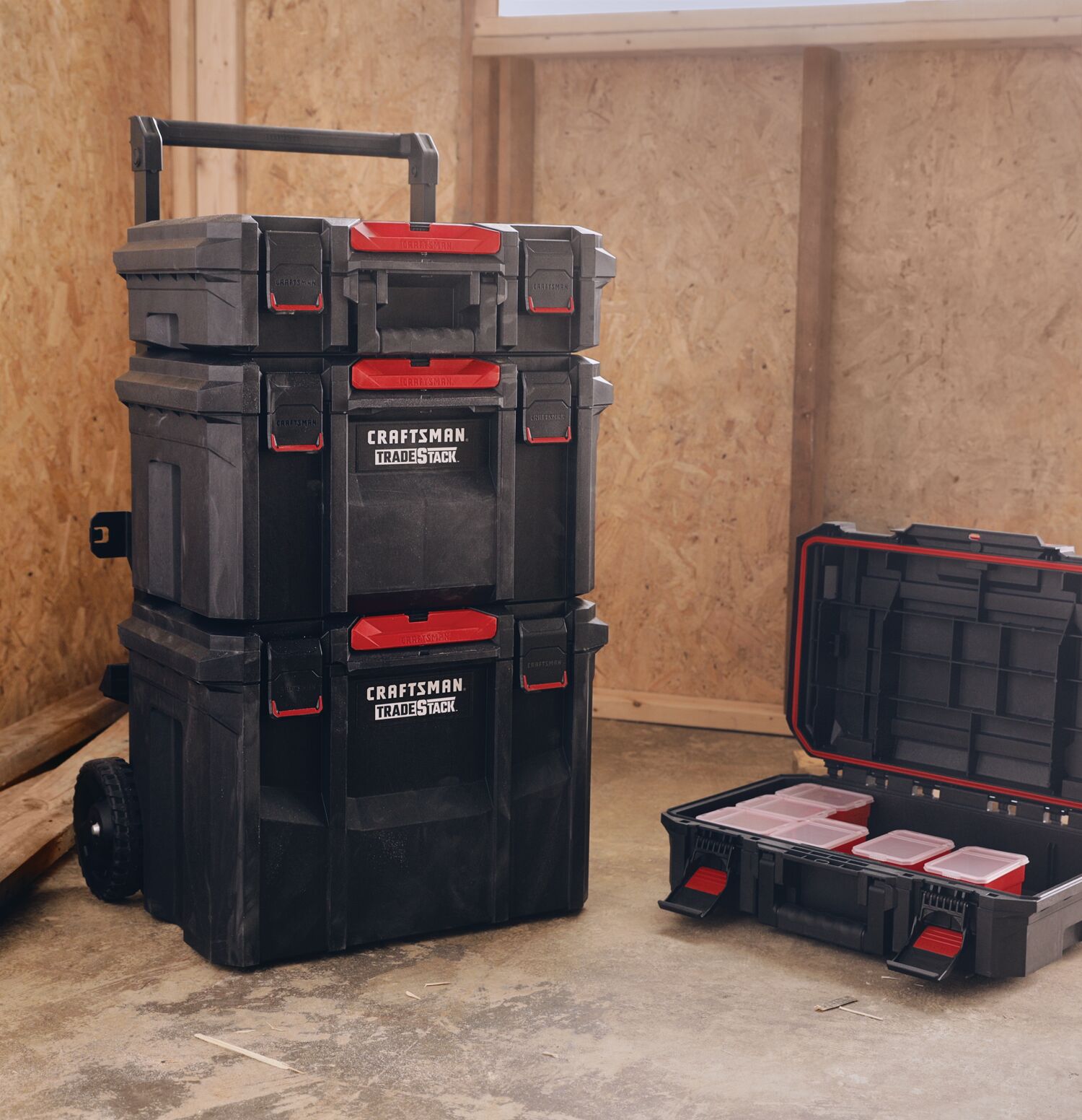 TradeStack Rolling Tower along with tool storage box placed on ground in a room.