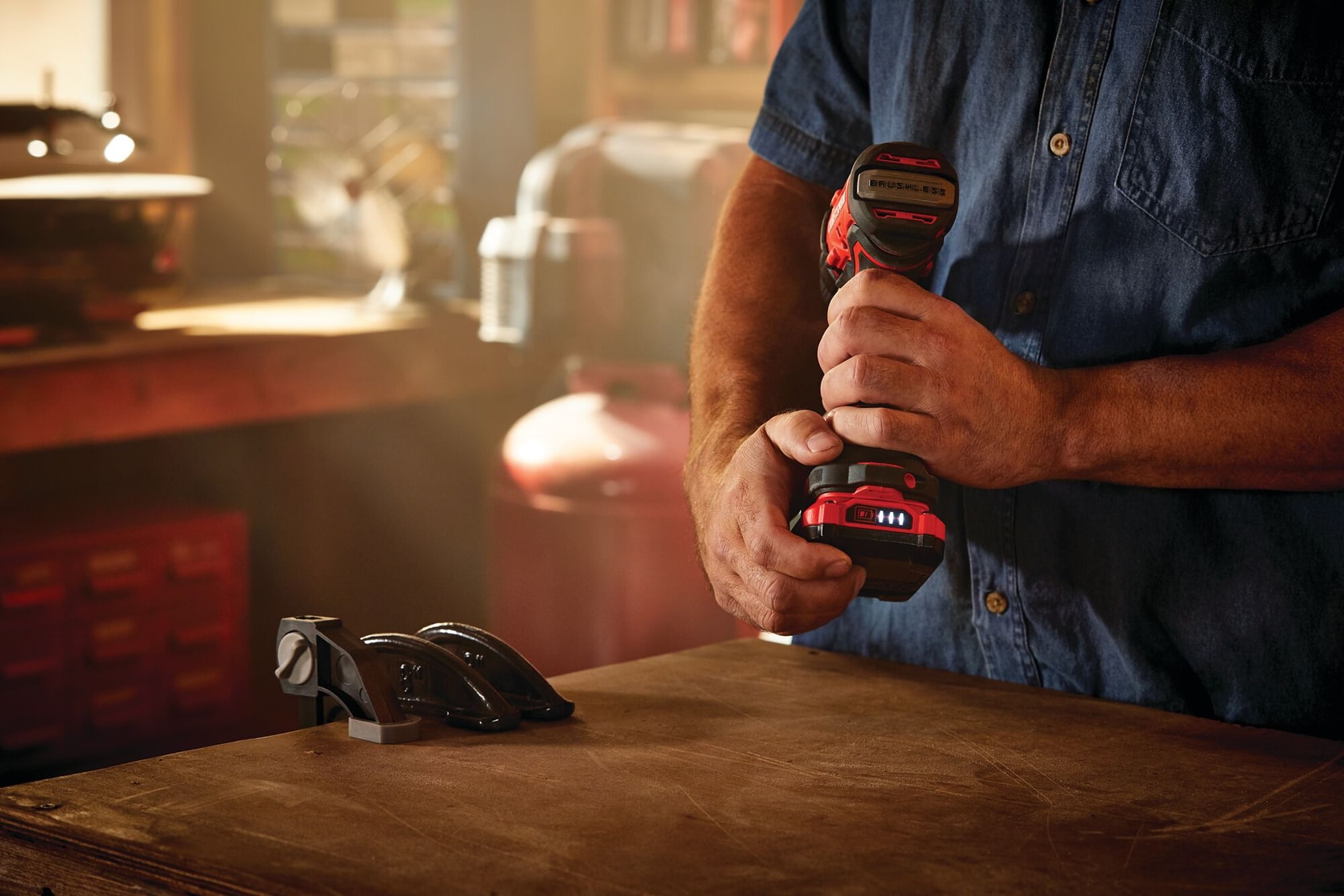 Cordless brushless half inch drill and driver kit 1 battery l e d light being used.