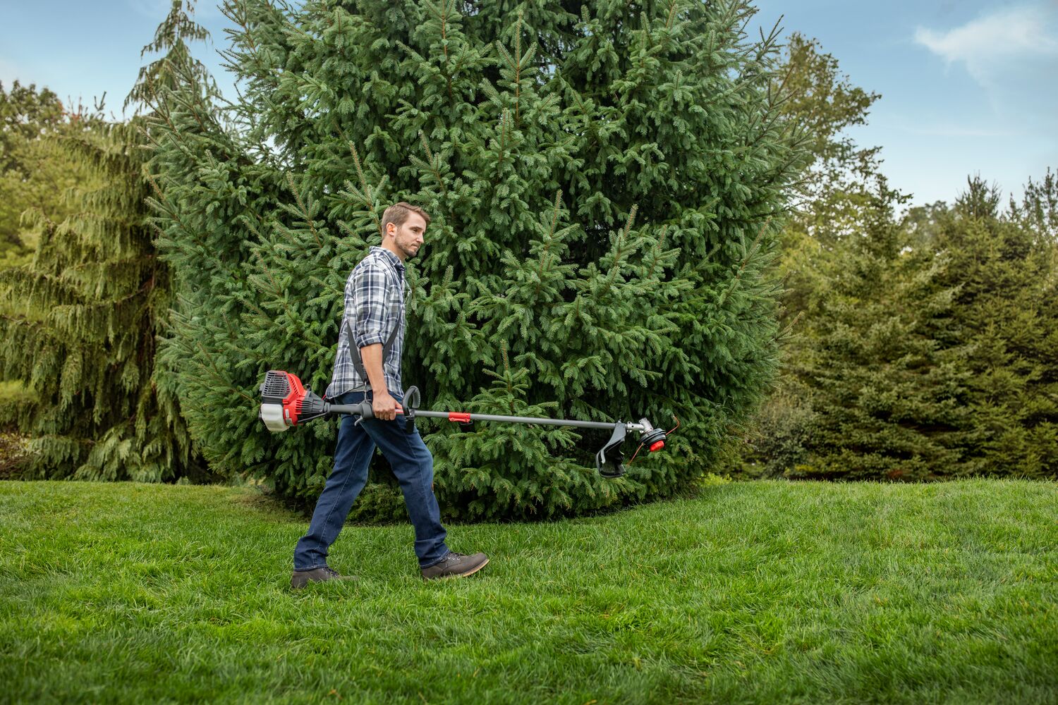CRAFTSMAN WS4200 WEEDWACKER being carried across yard with plaid shirt